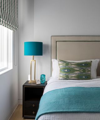 Neutral bedroom with teal accents