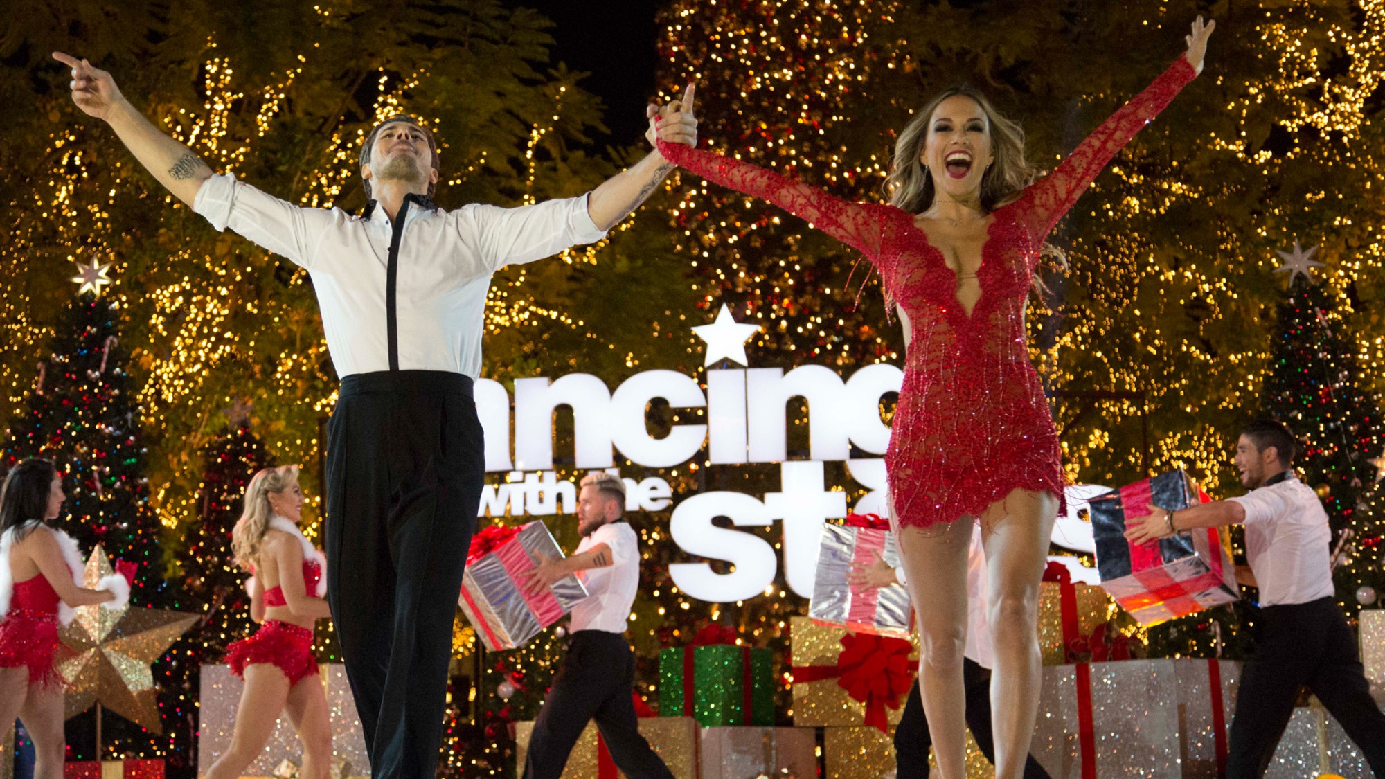 Gleb Savchenko and Jana Kramer with their hands up on Dancing With the Stars.