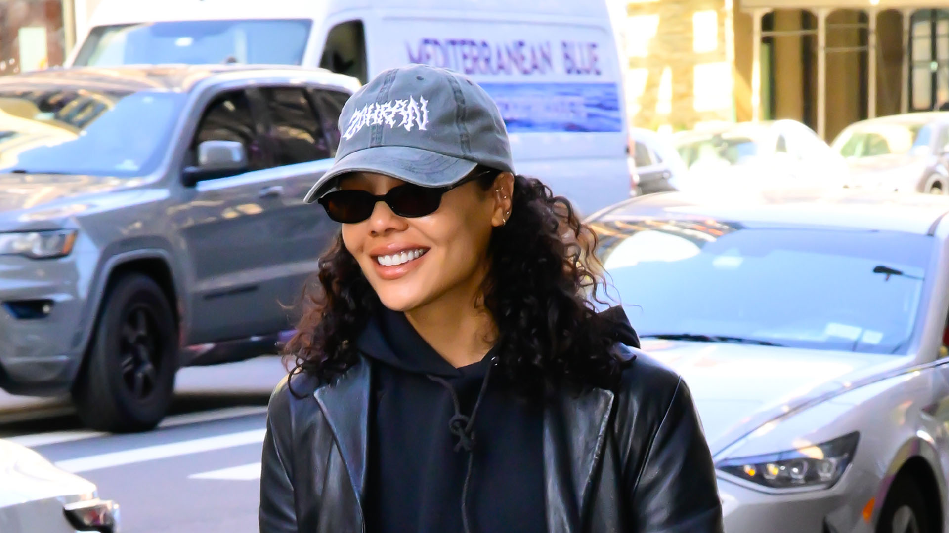 Tessa Thompson wearing an all-black outfit and burgundy loafers