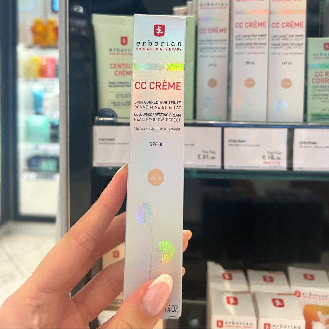 Hand holding box of Erborian CC Cre&amp;#768;me SPF30 40ml in World Duty Free