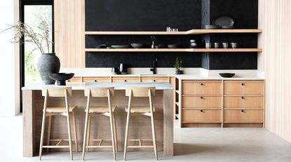 a kitchen with a modern fluted island