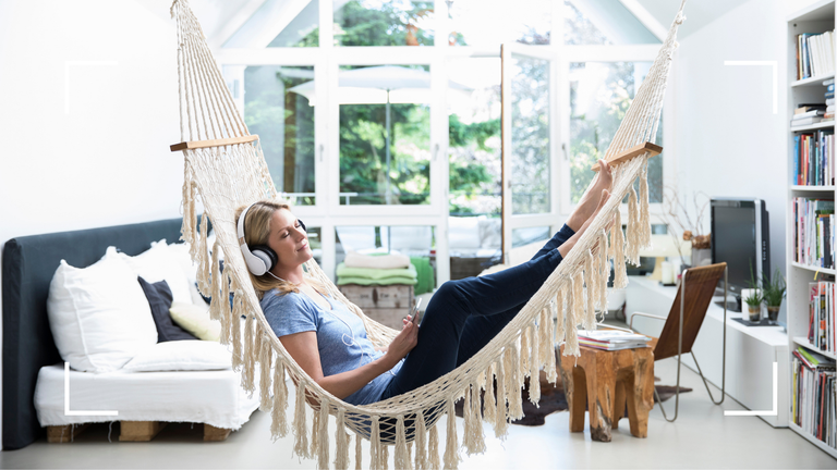Woman resting in a hammock at home