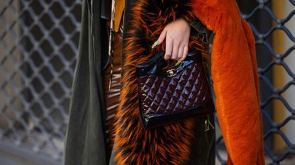 solid perfumes-street style paris fashion week woman with leather handbag and bright manicure