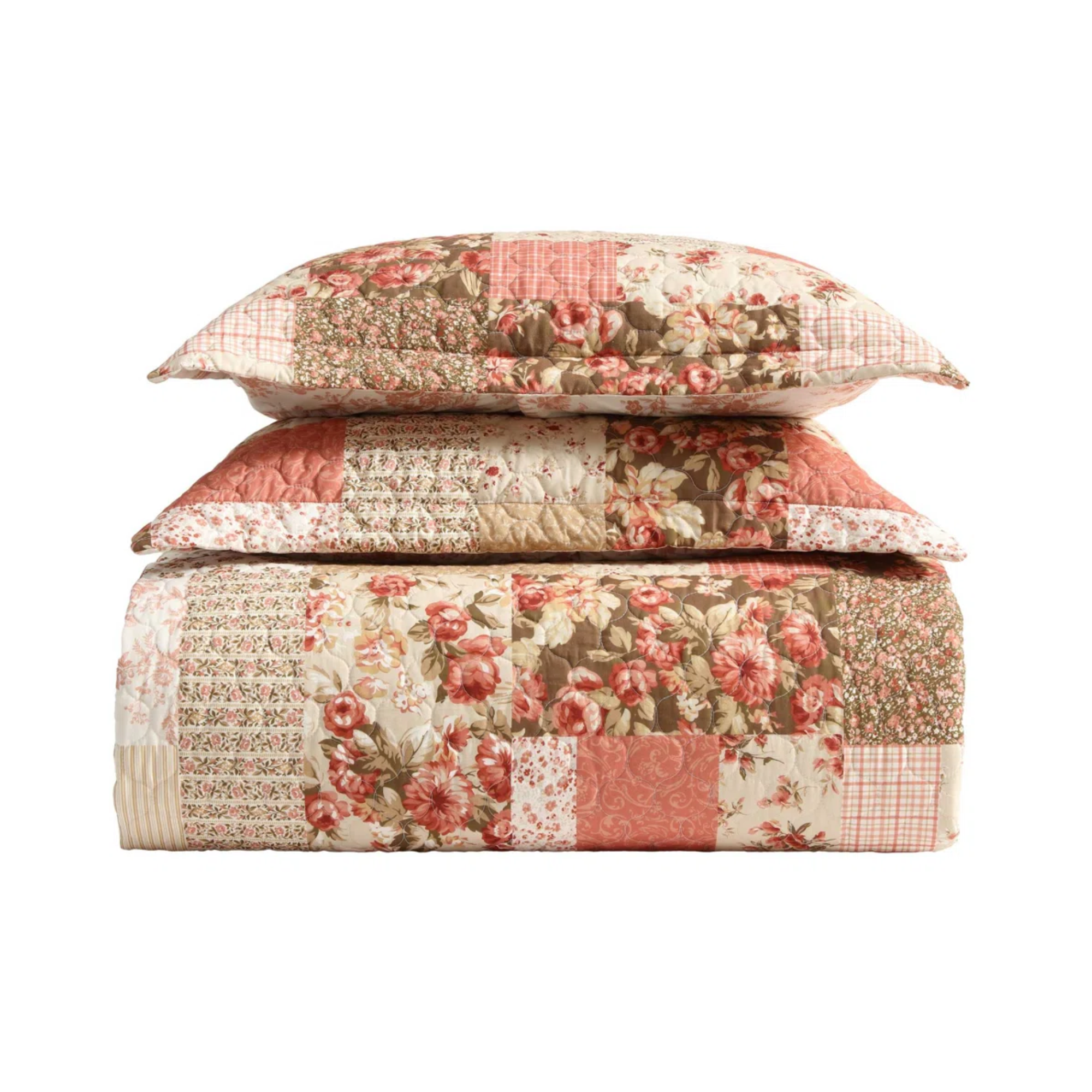 set of two pillows and a quilt in pink patchwork