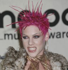 Pink headshot with pink spiky hair, 2000s