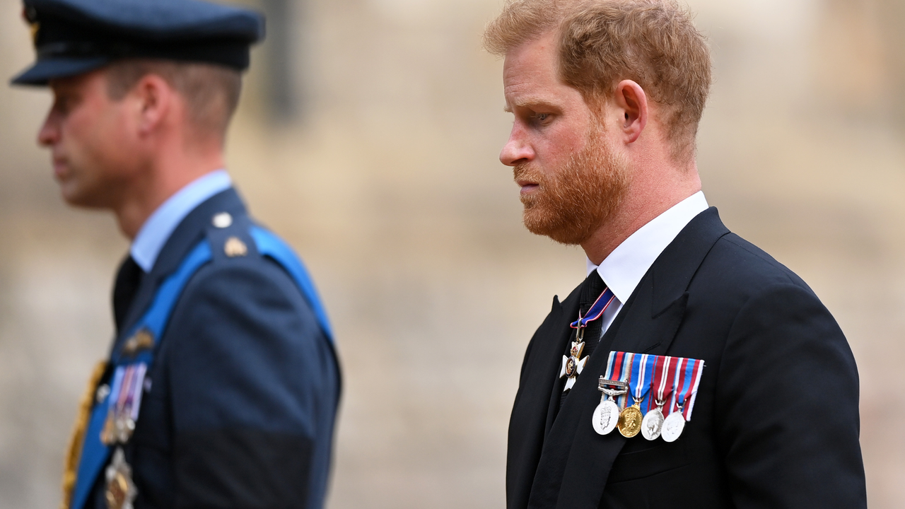 Prince William, Prince of Wales and Prince Harry, Duke of Sussex join the Procession following the State Hearse carrying the coffin of Queen Elizabeth II towards St George&#039;s Chapel on September 19, 2022 in Windsor, England.