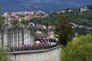 CAMIGLIATELLO SILANO ITALY OCTOBER 07 Nico Denz of Germany and Team Sunweb Harm Vanhoucke of Belgium and Team Lotto Soudal White Best Young Rider Jersey Joao Almeida of Portugal and Team Deceuninck QuickStep Pink Leader Jersey Magli City 576m Peloton Landscape Fans Public during the 103rd Giro dItalia 2020 Stage 5 a 225km stage from Mileto to Camigliatello Silano 1275m girodiitalia Giro on October 07 2020 in Camigliatello Silano Italy Photo by Tim de WaeleGetty Images