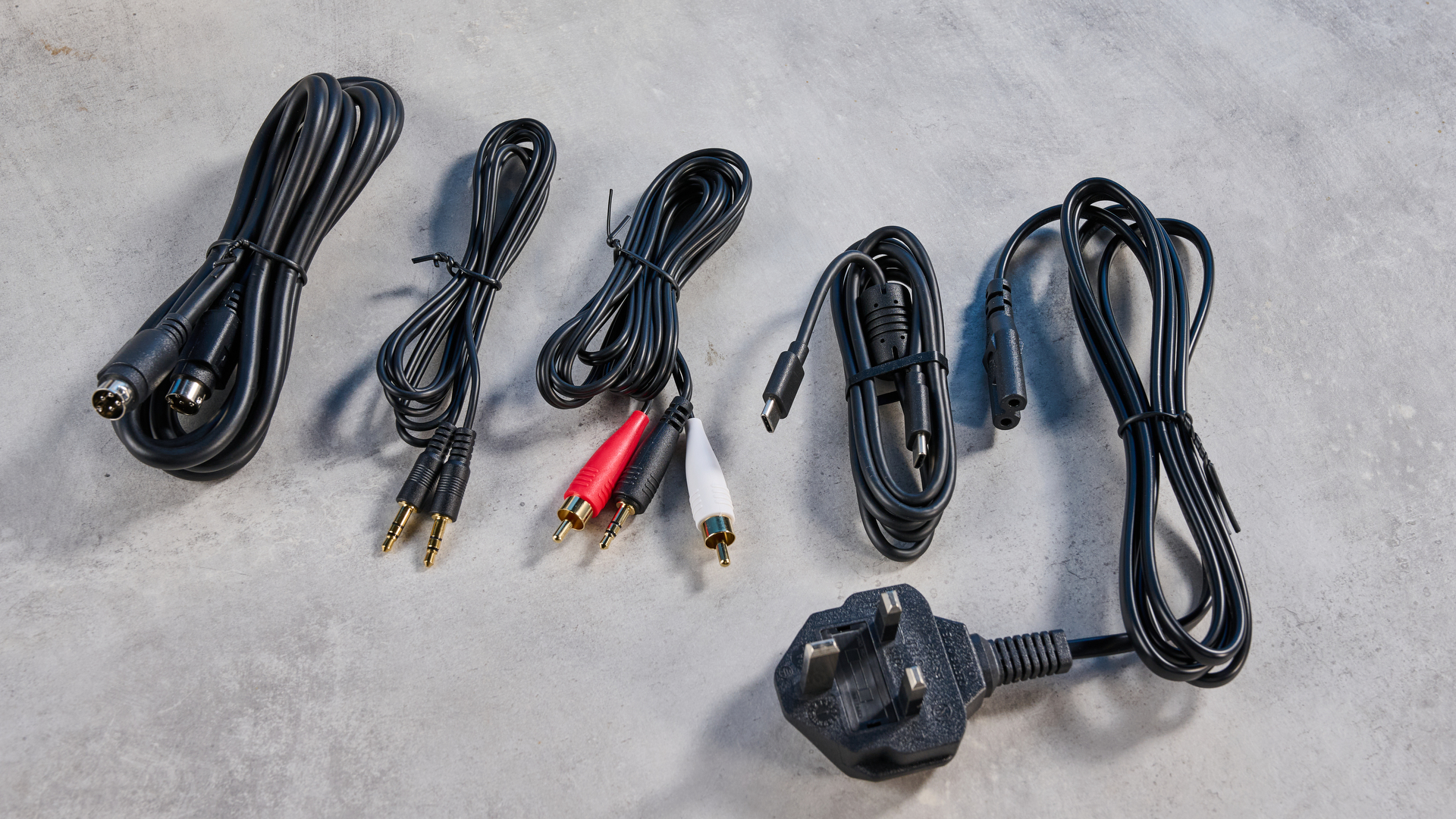 the edifier m60 bookshelf speakers in white photographed against the blue tom's guide background