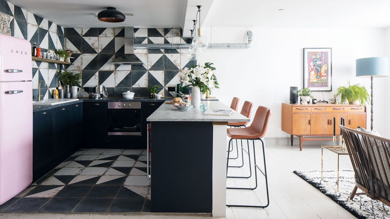 kitchen with black and white coloured and chairs