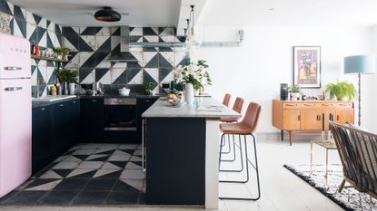 kitchen with black and white colored and chairs