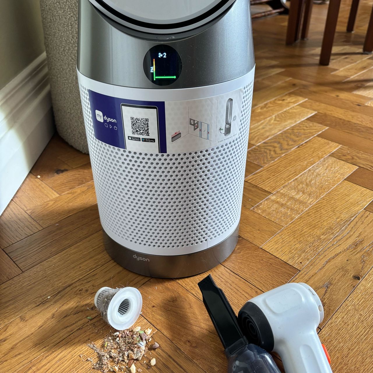 vacuum debris and dust by a dyson purifier cool