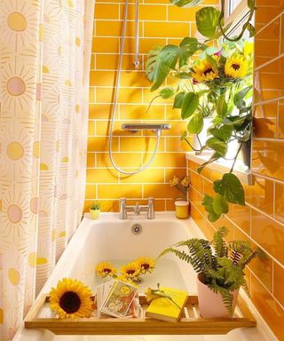 Yellow tiled bathroom with sunflowers and sun print shower curtain