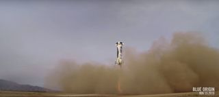Blue Origin's New Shepard rocket first stage descends toward its landing pad after a successful unmanned suborbital test flight from its West Texas launch site on Nov. 23, 2015 in this still image from a Blue Origin video.