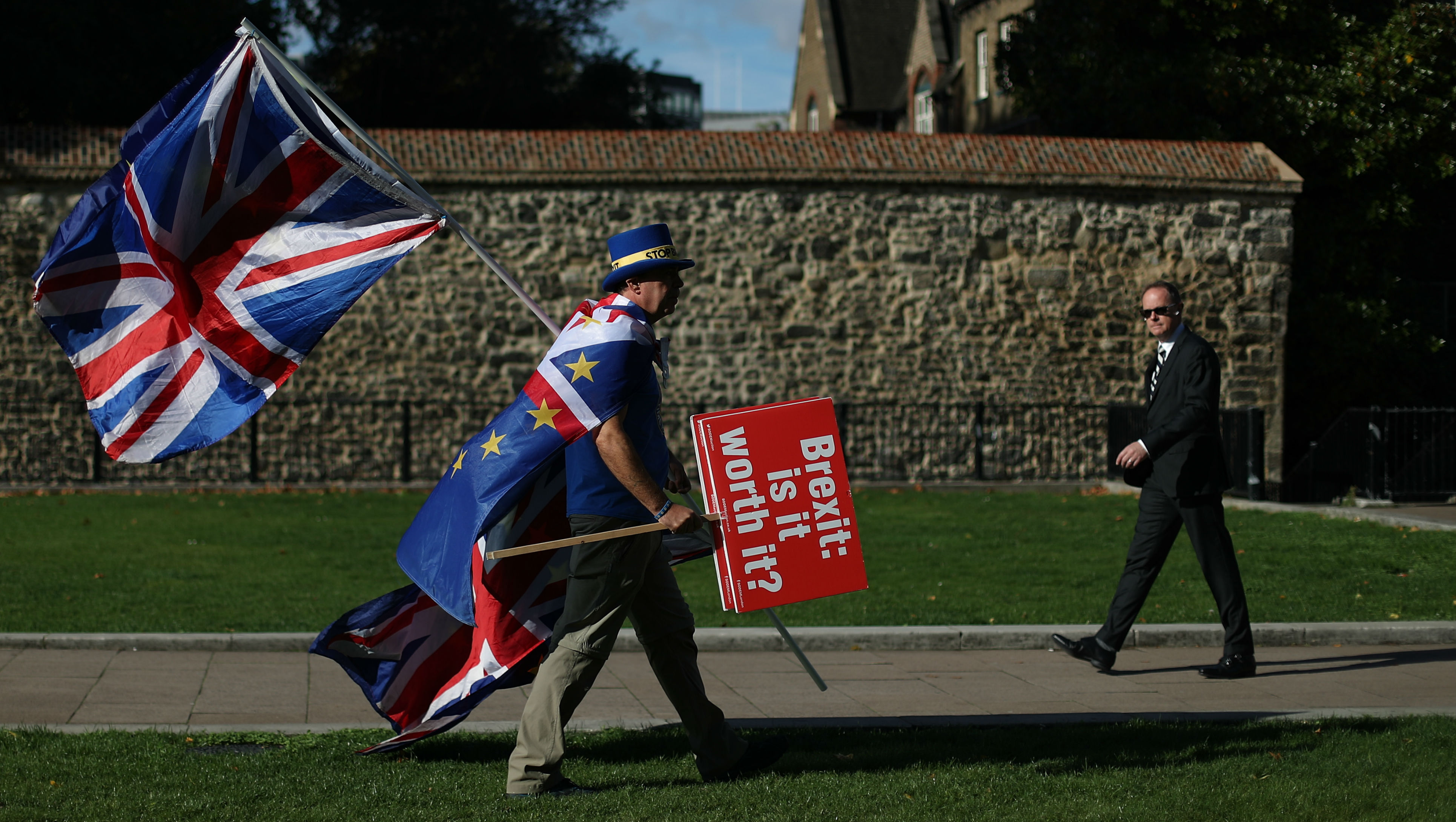 An anti-Brexit campaigner walks outside the Houses of Parliament