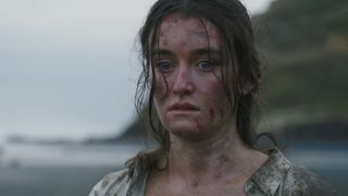 Close-up of Leah Rilke (Sarah Pidgeon) covered in mud in The Wilds season 2