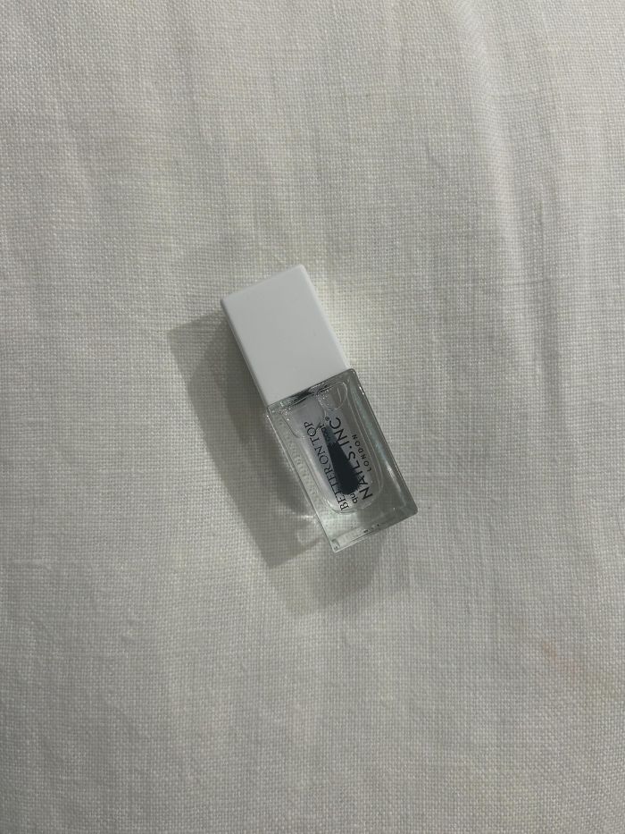 The Nails Inc. Better On Top Quick-Drying Top Coat on a white linen background