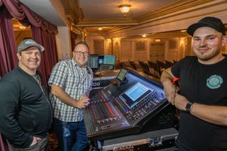 Smiling sound engineers surround their DiGiCo mixers and solutions.