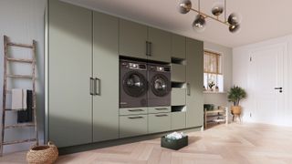bank of green floor to ceiling cupboards with built in washer and dryer