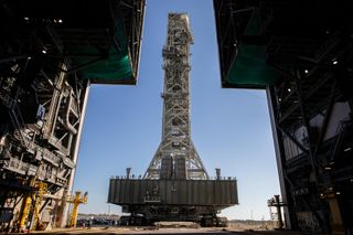 A view from inside the Vehicle Assembly Building at NASA's Kennedy Space Center in Florida on Dec. 9, 2022, as the mobile launcher approaches, carried atop the crawler-transporter 2 vehicle..