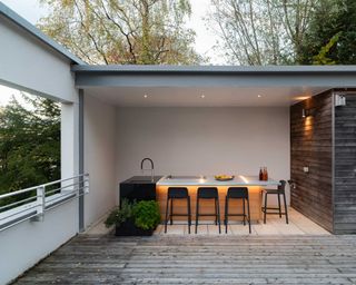 covered modern outdoor kitchen by CENA Outdoor Kitchens