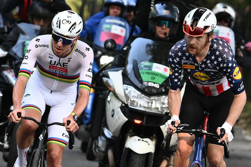 UAE Team Emirates’s Slovenian rider Tadej Pogacar (L) attacks to take the lead past Lidl-Trek’s US rider Quinn Simmons (R), in the Passo Di Ganda ascent during the 119th edition of the Giro di Lombardia (Tour of Lombardy), a 238km cycling race from Como to Bergamo on October 11, 2025. (Photo by Marco BERTORELLO / AFP)