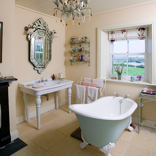bathroom with tiled flooring and white bathtub