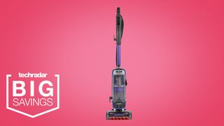 The Shark Anti Hair Wrap Upright Vacuum Cleaner with Powered Lift-Away NZ850UK on a pink background