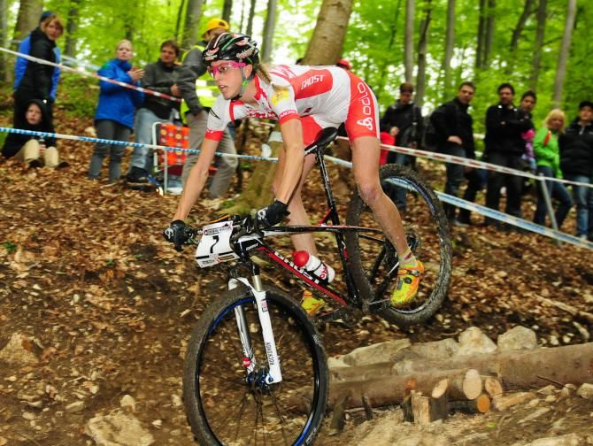 Katrin Leumann (Ghost Factory Team) riding down a series of rock gardens and jumps