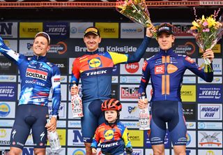 KOKSIJDE BELGIUM MARCH 21 LR Luke Lamperti of The United States and Team Soudal QuickStep on second place race winner Edward Theuns of Belgium and Team LidlTrek and Nils Eekhoff of Netherlands and Team Picnic PostNL on third place pose on the podium ceremony after the 23rd Bredene Koksijde Classic 2025 a 2009km one day race from Bredene to Koksijde on March 21 2025 in Koksijde Belgium Photo by Luc ClaessenGetty Images