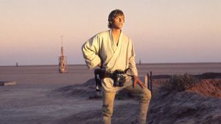 Luke Skywalker looks out at a Tatooine sunset in Star Wars Episode IV: A New Hope