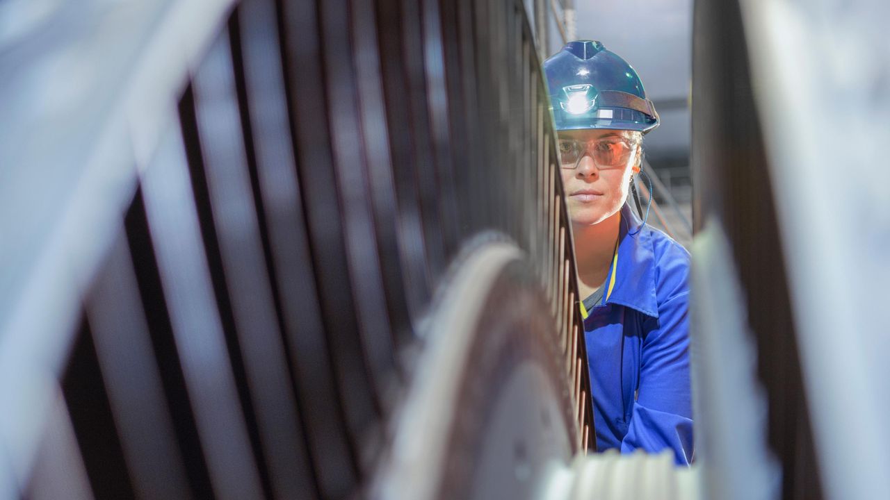 A woman works at a nuclear power plant.