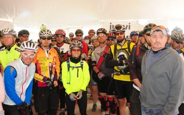Team racers wait inside the transfer tent for their teammates so they can start their lap.