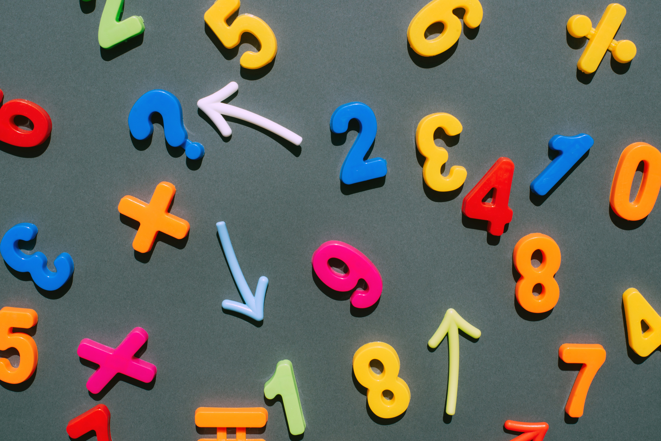 Multicolored number magnets on a black background