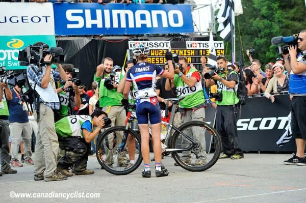 Julie Bresset (France) was mobbed at the finish by the press