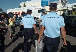 Déjà vu: Gendarmes march in to arrest Cristian Moreni (Cofidis)