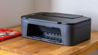 Canon PIXMA TS3520 Wireless All-In-One Inkjet Printer being tested in writer's home