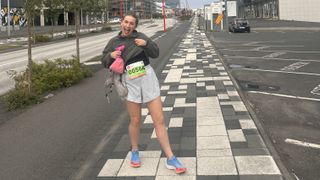 author posing with marathon bib