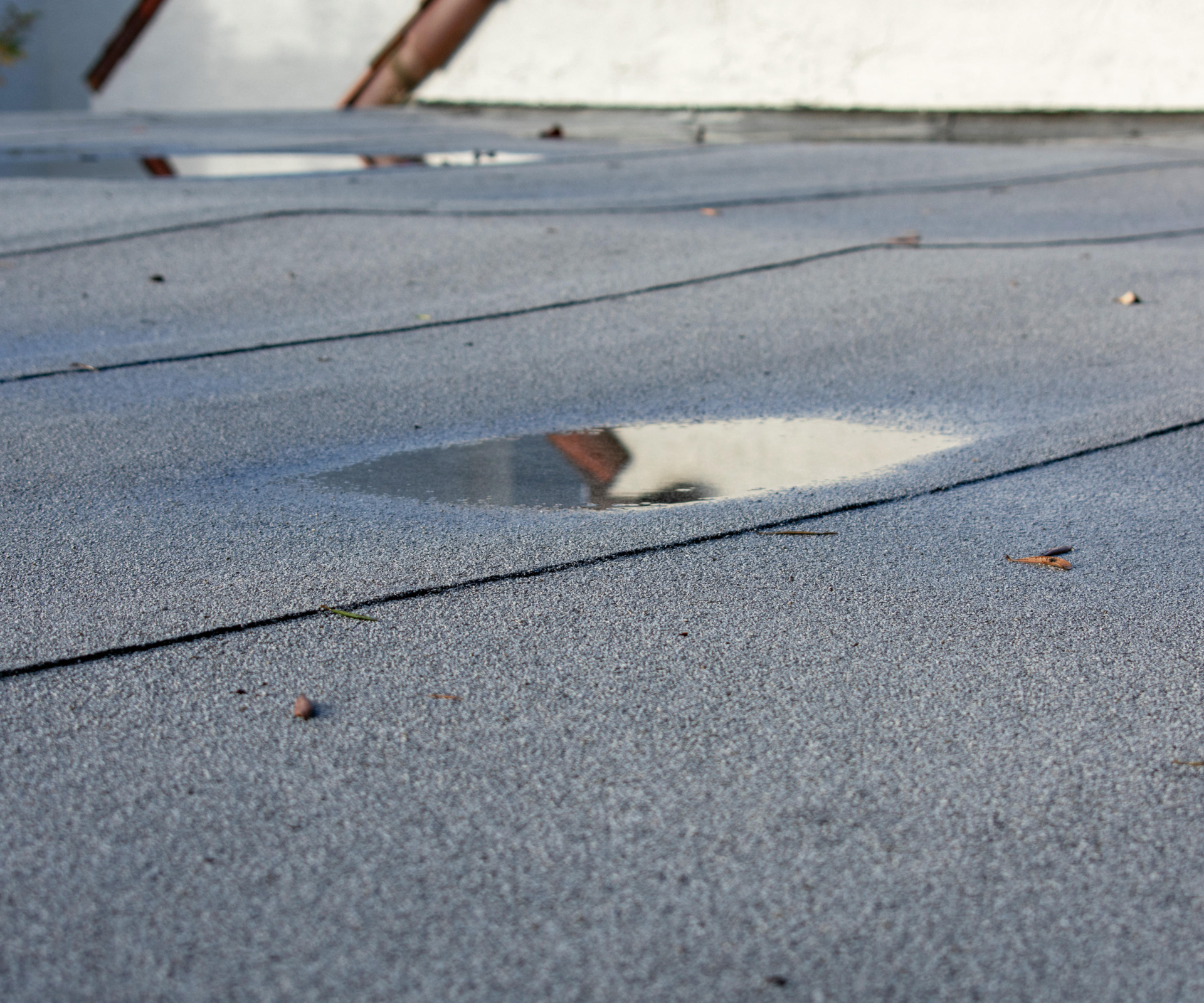 Pool of water collecting on a flat roof
