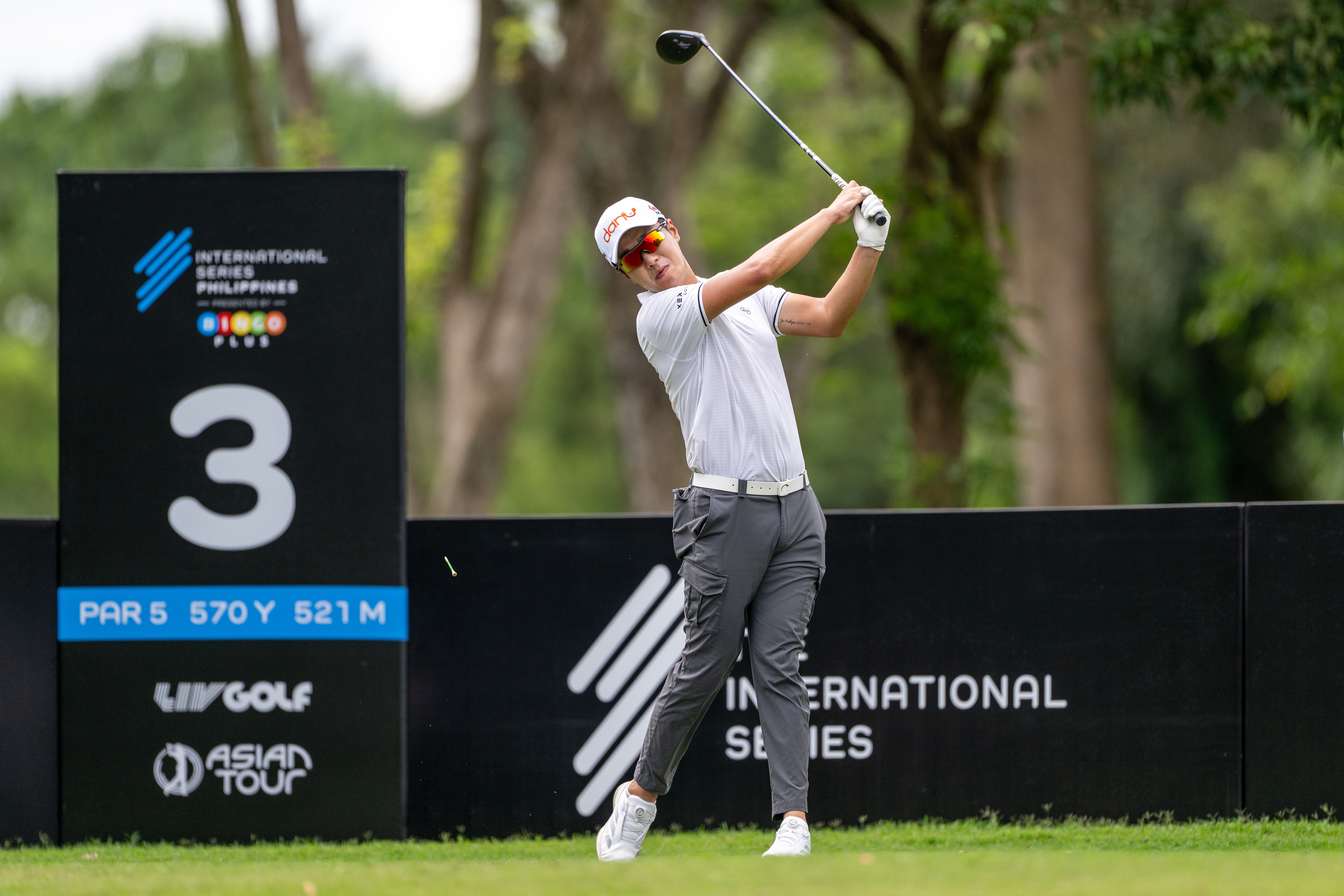 Changwoo Lee hits a driver off the tee