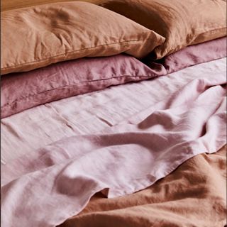 Terracotta, Lavender & Rosewater Bedding Bundle on a bed.