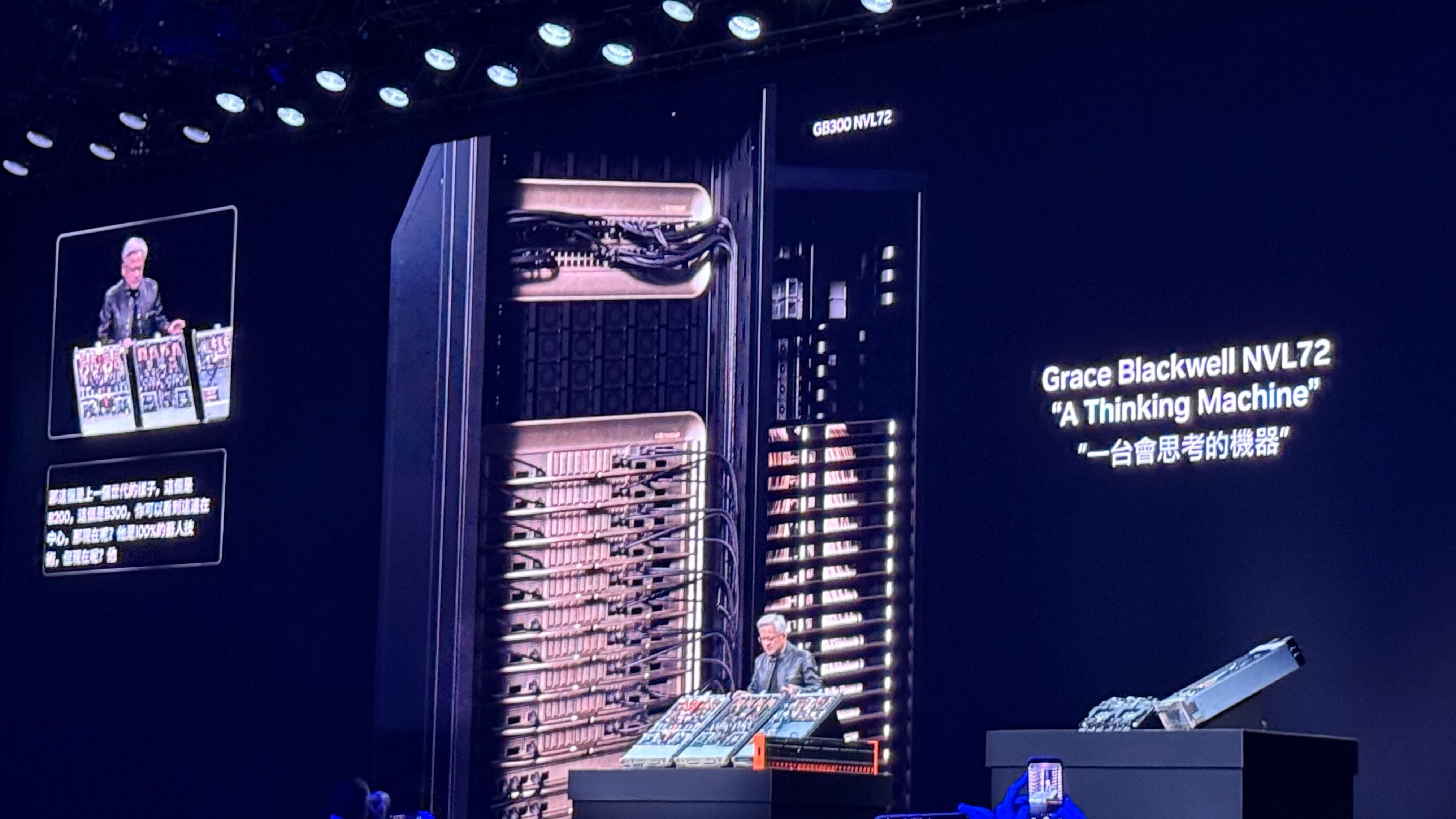 Nvidia CEO Jensen Huang shows off the new Grace Blackwell NVL72 AI super-computer server rack at the company's Computex keynote.