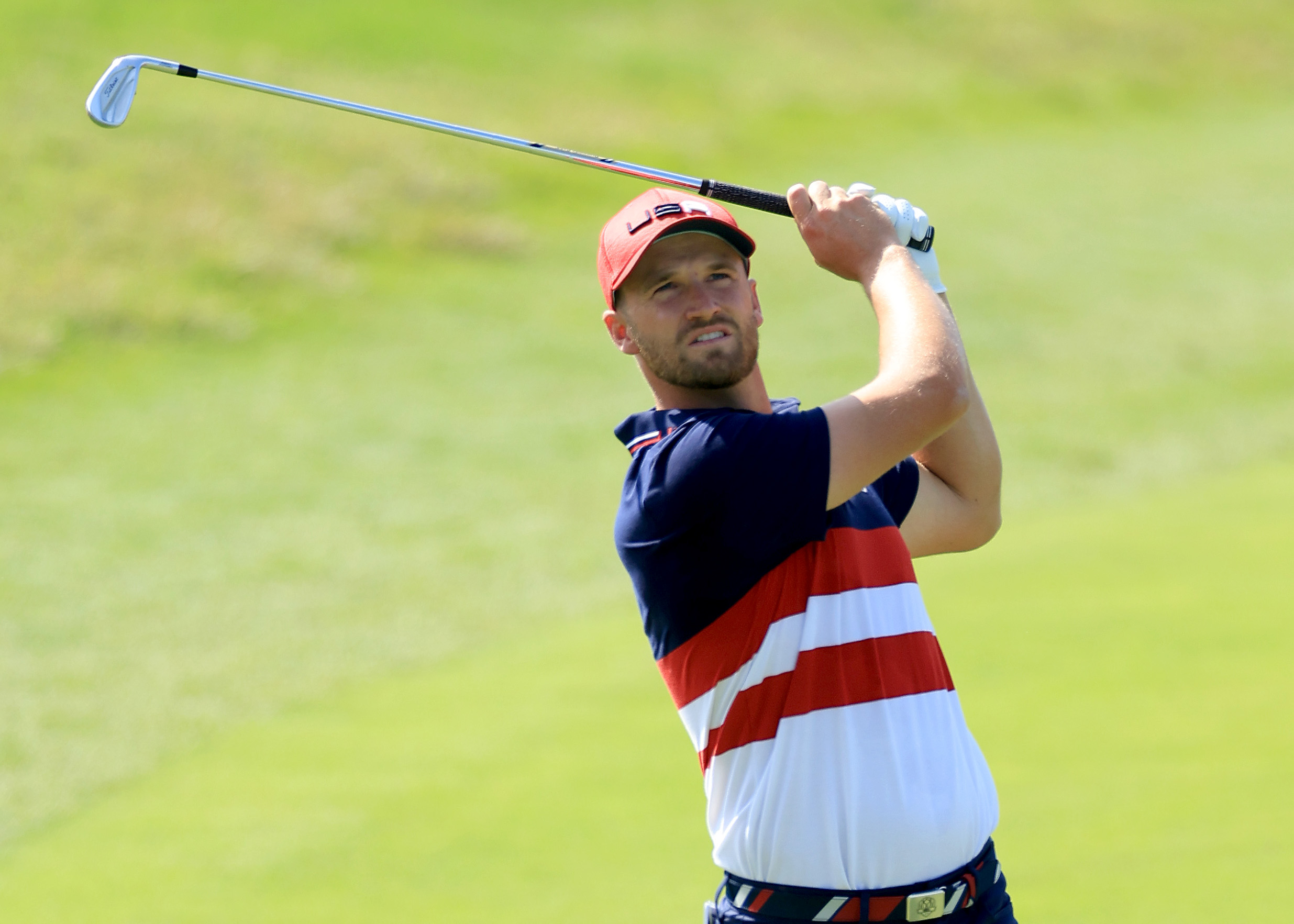 Wyndham Clark hits an iron shot at the Ryder Cup