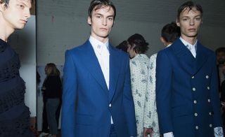 Males modelling in blue blazers