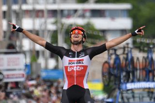 Team Lottos Brent Van Moer of Belgium celebrates as he crosses the finish line at the end of the first stage of the 73rd edition of the Criterium du Dauphine