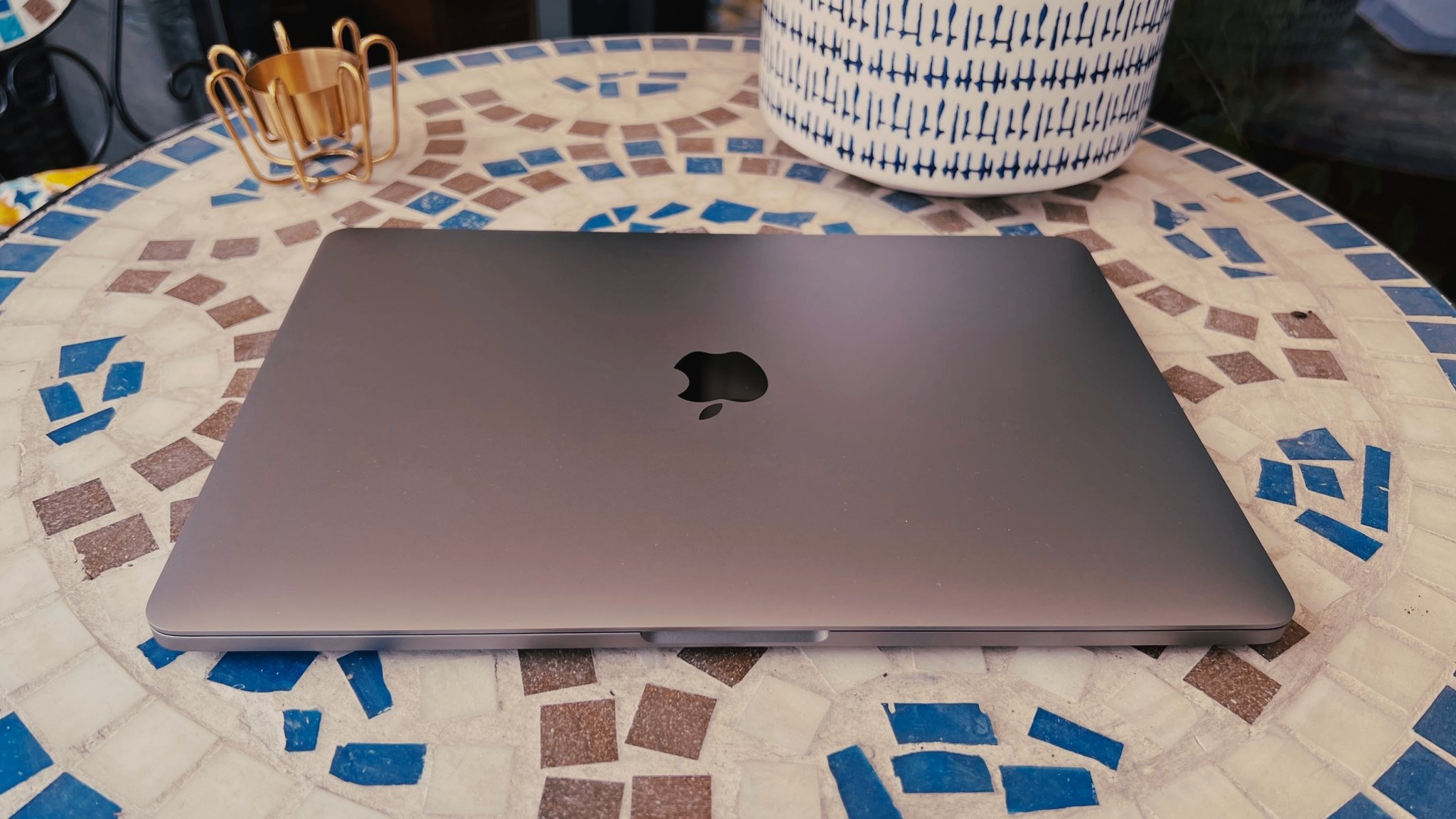 A 13-inch MacBook Pro on top of a colorful table