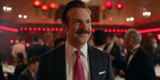 Ted Lasso (Jason Sudeikis) smiles in Ted Lasso