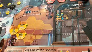 Apiary board filled with tokens, models, and sci-fi imagery