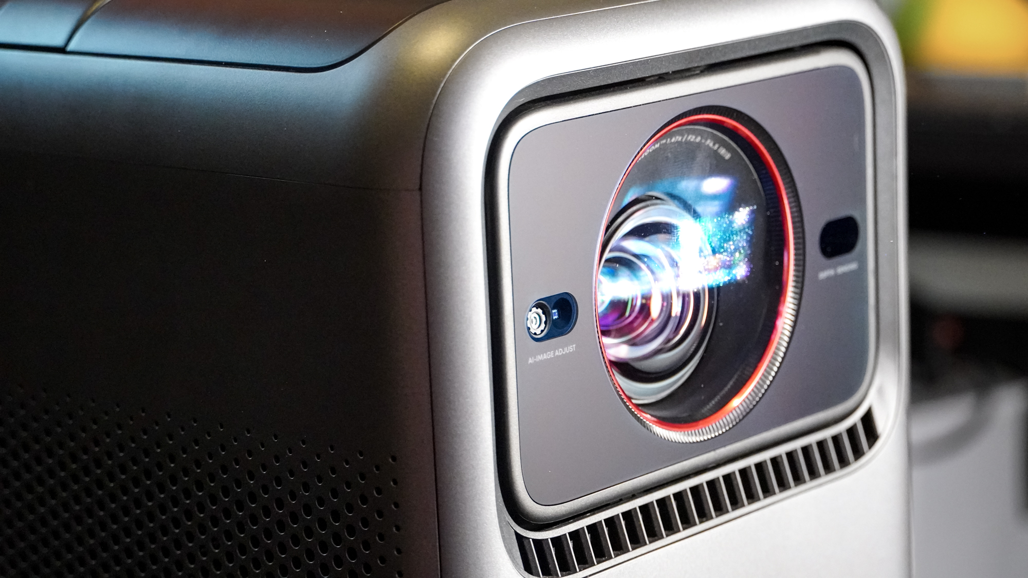 The lens on an Anker Nebula X1 projector pointing forward.