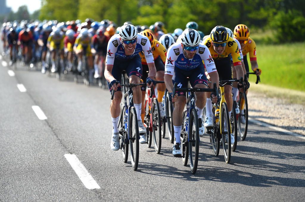 HAJDSZOBOSZL HUNGARY MAY 12 LR Tim Declercq of Belgium Florian Senechal of France and Team QuickStep Alpha Vinyl and Tim Van Dijke of Netherlands and Team Jumbo Visma lead the peloton during the 43rd Tour de Hongrie 2022 Stage 2 a 192km stage from Karcag to Hajdszoboszl tourdehongrie on May 12 2022 in Hajdszoboszl Hungary Photo by Dario BelingheriGetty Images