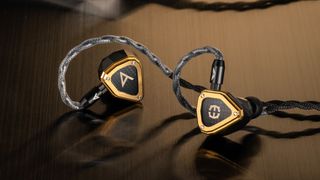 The Astell&Kern X Empire Ear Novus IEMs in gold and black